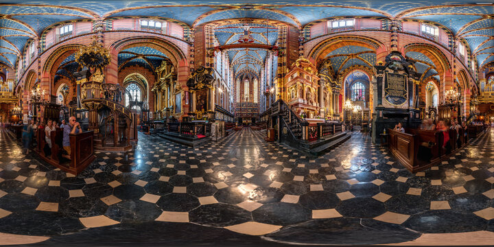 KRAKOW, POLAND - AUGUST 2022: Full spherical seamless hdri panorama 360 degrees inside interior of old gothic catholic Mariatsky church in equirectangular projection, VR content