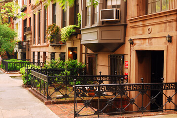 Beautiful historic brownstone residential buildings populate the Gramercy Park neighborhood of New York City.  The residents call the area block beautiful