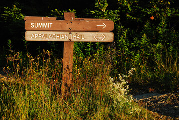 A wooden sign points to t he summit of Mount Greylock, the highest point in Massachusetts and a highlight on the Appalachian Trail