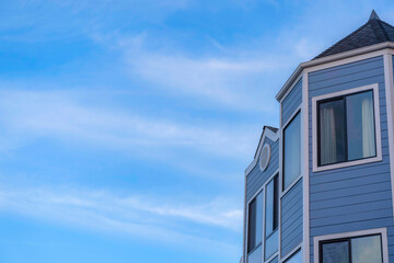 View of a house exterior with light blue vinyl lap sidings in San Francisco, California