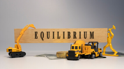 Equilibrium was written on the wooden surface. economy and business.