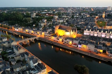 Obraz premium Evening aerial view of the city of Laval and the Mayenne river. France