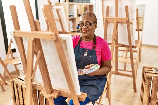 Senior african american woman smiling confident drawing at art studio