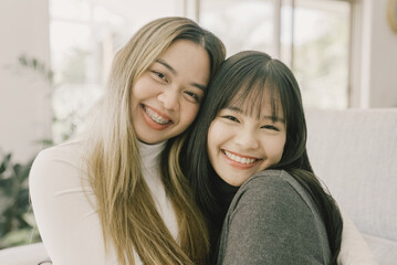 Happy young Asian women smiling and looking at camera, video call blogger concept