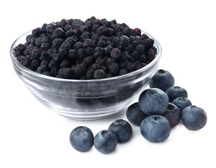 Sweet sublimated and fresh blueberries on white background