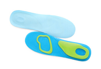 Light blue orthopedic insoles isolated on white, top view