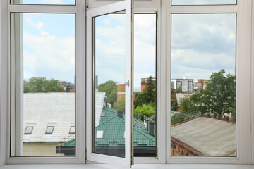 Open window with white plastic frame indoors