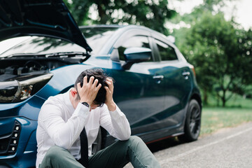 Asian businessman broken car engine breakdown his stressed emotion problem, Accident emergency on the mountain road outdoor late for work concept.