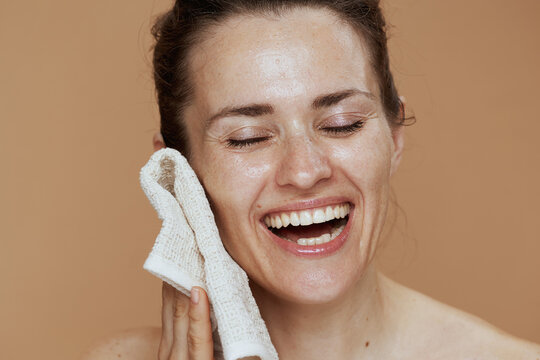 Happy Woman With Towel Washing Face