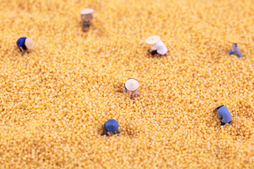 Miniature scene straw hat farmer working
