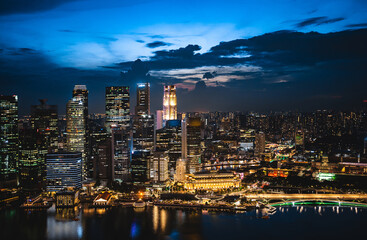 Singapore city skyline with modern skyscraper architecture building for concept of financial business and travel in Asia cityscape urban landmark, marina bay at night district dusk sky