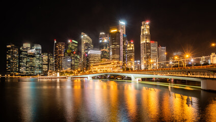 Singapore city skyline with modern skyscraper architecture building for concept of financial business and travel in Asia cityscape urban landmark, marina bay at night district dusk sky