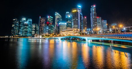 Singapore city skyline with modern skyscraper architecture building for concept of financial business and travel in Asia cityscape urban landmark, marina bay at night district dusk sky