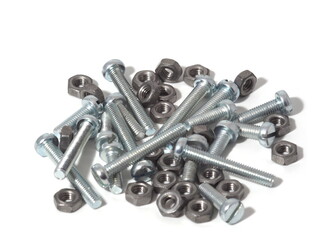 Screws of different lengths and nuts on a white isolated background.