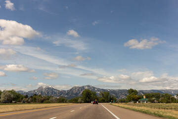 A view on the road and mountains with snow