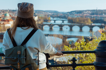 trendy woman in sweatshirt in Prague Czech Republic sightseeing