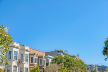 Fototapeta na wymiar Townhouses with emergency ladders and bay windows at San Francisco, California