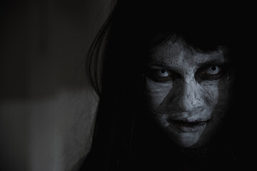 Asian woman ghost or zombie horror creepy scary close up she face and hair covering the face her...