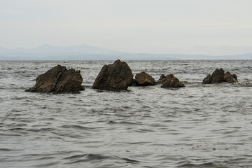 Fototapeta na wymiar rocks protruding from the water