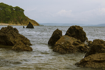 Fototapeta na wymiar rocks protruding from the water