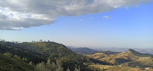 valley and mountains with cloudy sky