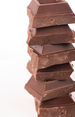 chocolate pieces. dark chocolate bars stacked high