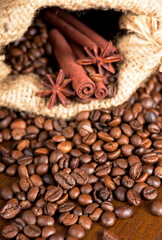 coffee beans, cinnamon sticks and star anise dark background