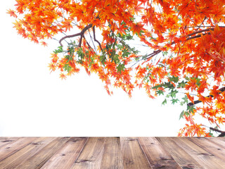 Naklejka na ściany i meble Wooden table top over orange maple leaves in autumn.