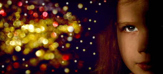 Close up portrait of pretty serious girl waiting holiday, looking mindfully at bright bokeh lights,...