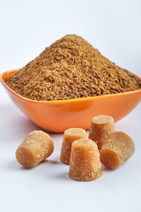 Organic Gur or Jaggery Powder and cubes, Jaggery is used as an ingredient in sweet and savoury dishes in the cuisines of India.