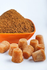 Organic Gur or Jaggery Powder and cubes, Jaggery is used as an ingredient in sweet and savoury dishes in the cuisines of India.