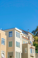 Fototapeta na wymiar Multi-storey suburban houses with painted walls and wood sidings in San Francisco, California