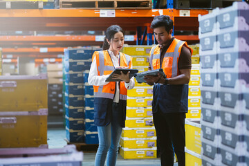 Warehouse worker and manager checks stock and inventory with digital tablet computer in the retail...