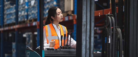 Panoramic Smart engineer woman worker doing stocktaking of product management in forklift machine on shelves in warehouse. Factory physical inventory count. © Shutter B