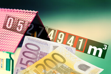 Ein Haus, Gaszähler und Euro Geldscheine