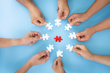 Business concept, Group of business people assembling jigsaw puzzle and represent team support and help togethe