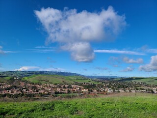 Fototapeta na wymiar A unique cloud hangs over San Ramon valley, California