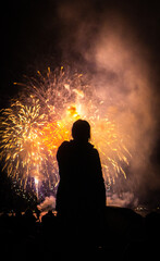 Plakat silhouette of a person in fireworks 