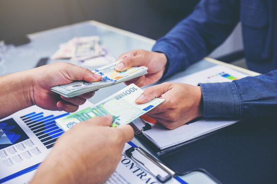 Exchange money, Top view of Business people exchange US Dollar money for Euro money. Business exchange and investment concept - Powered by Adobe