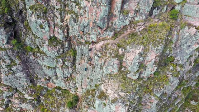 Drone shots of climbers at the Urubamba cliffs in Cusco, Peru. It is also known as the Sacred Valley. Climbers are climbing the mountain to their Airbnb. Shots are in Full HD