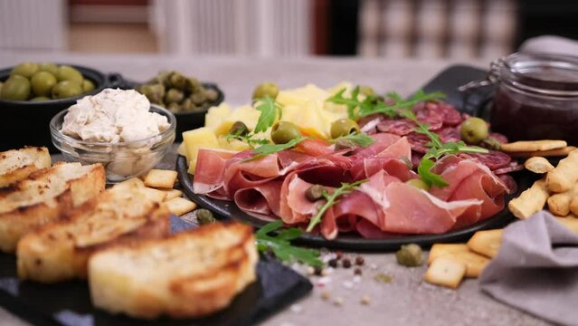 meat and cheese plater and bruschetta grilled bread