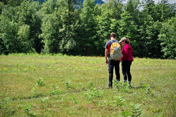 Mature couple hiking along mountain valley in Alberta, Canada