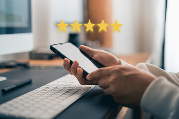 Hand and Phone With Five Star Rating