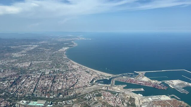 Aerial view of Valecia city in Spain, landscape of the notrh coast, at 2000 metre high. 4K