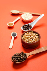 Different ingredients for cooking on orange background