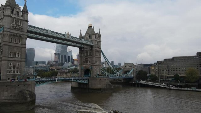 Boat crossing the Tower Bridge in the Thames River, London