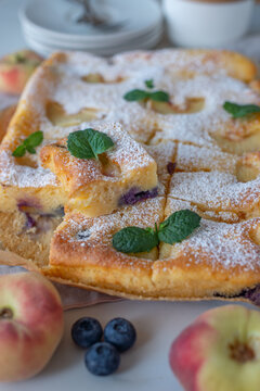 Delicious home made peach pie with blueberries and ricotta
