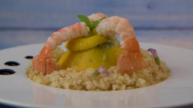 Recipe for Boulghoursotto and mini patisson stuffed with mozarella and basil and its scampi on turntable, High quality video