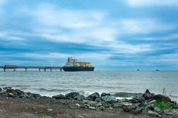 liquefied natural gas carrier tanker during loading at an LNG offshore terminal - obrazy, fototapety, plakaty