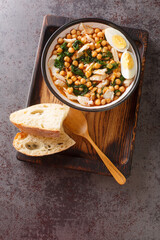 Spanish Easter dish called potaje de vigilia using cod with chickpeas, smoked paprika and spinach...